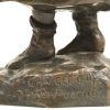 “Meisje met boek en mand”. Een brons gepatineerd beeldje, getekend “Chargeboeuf d’après Pascau”.