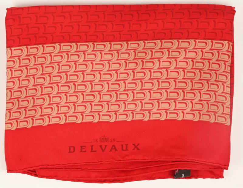 Een rode zijden foulard met D logo in het motief, gemerkt Delvaux.