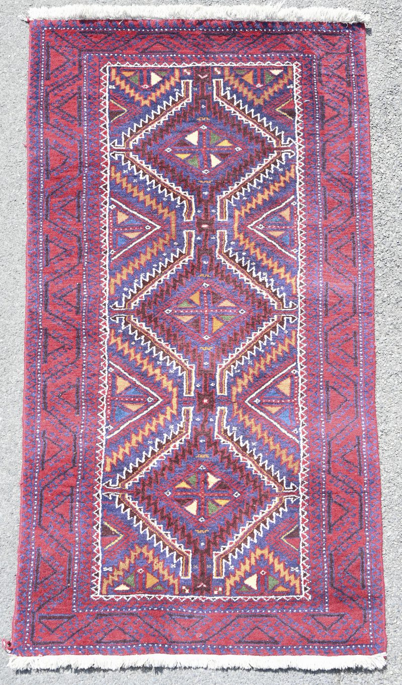 Een Iraans handgeknoopt tapijt, genummerd 56433.