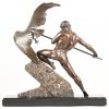 Een beeld in zamac met marmeren voet getiteld ‘la chasse à l’aigle’ in de marmer gesigneerd Van de Voorde George.