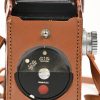 Een vintage camera model Super Ricohflex met lederen tas.