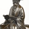 “Toba on his mule”. Een brons gepatineerd beeld van een Aziatische ruiter op ezel, met perkament in hand.