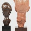 Een lot van 2 kinderhoofdjes waarvan een houten beeldje gesigneerd Patrick op sokkel en een terracotta hoofdje getekend P Sersté, Belgium, eveneens op sokkel.