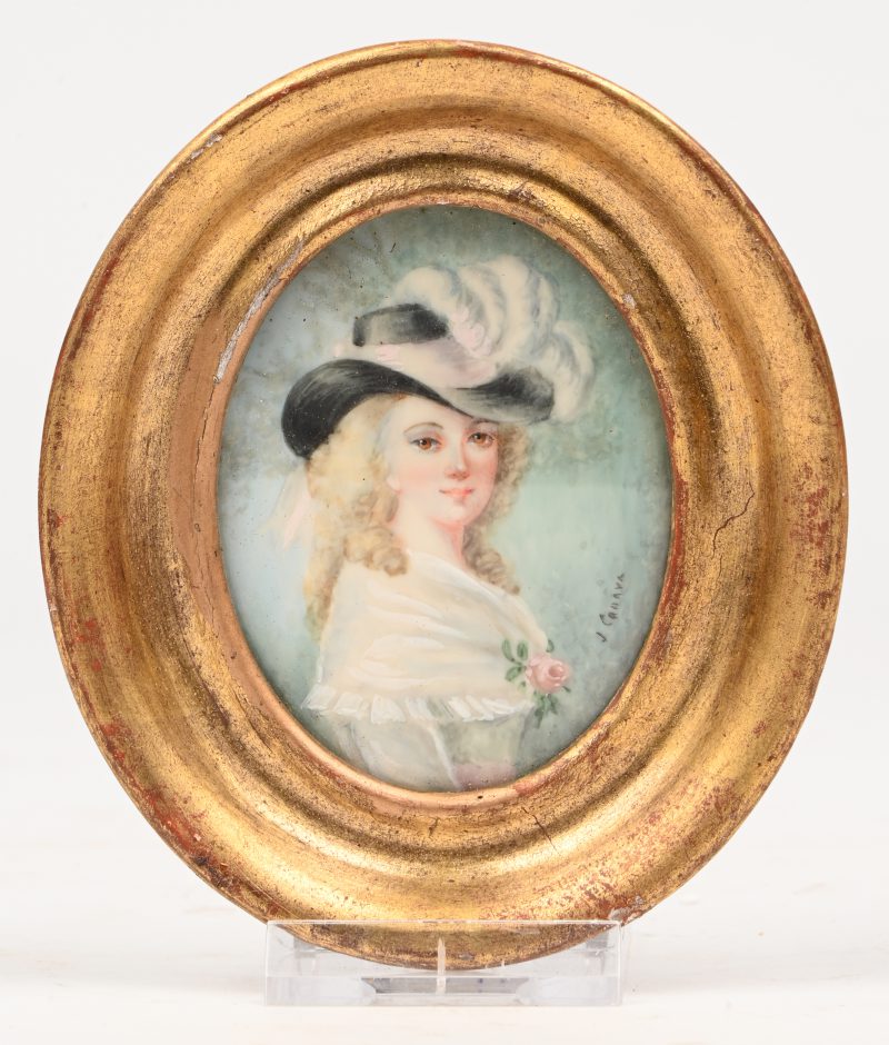 Een miniatuur portret in ovalen kadertje.