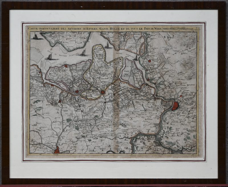 Een vroeg 18e eeuwse grensgekleurde kaart van het Waasland, getiteld Carte particulière des environs d’Anvers, Gand, Hulst et tout le pays de Waes’. Lichte roestzweem, in kader.