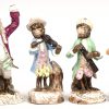 Een lot van 8 porseleinen monkey band figuurtjes. 5 met breukschade.