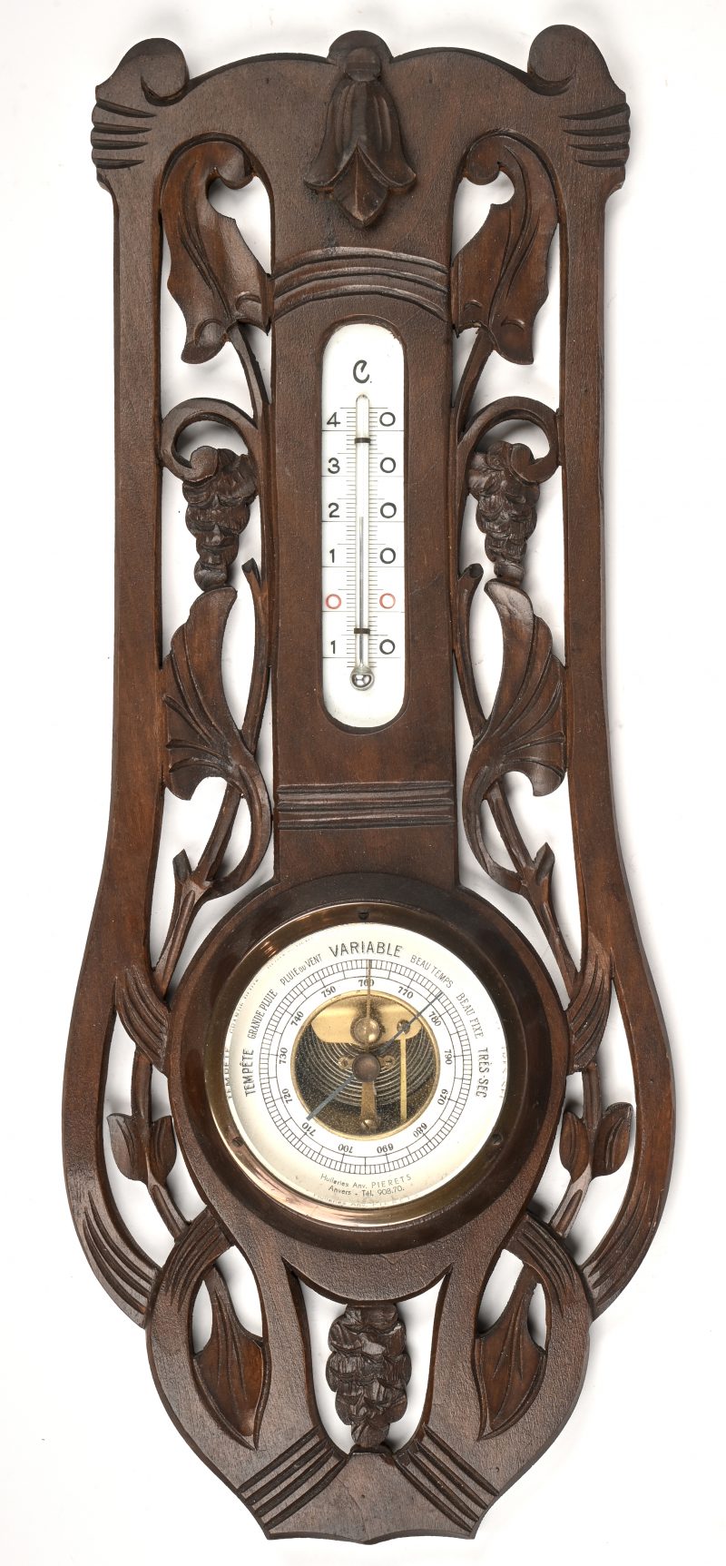 Een barometer en thermometer in houten kader.