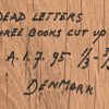 ‘Dead letters, three books cut up’, A.1.7.95. Een triptiek, getekend Denmark.
