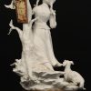 Een beeldje in biscuit voorstellend een meisje en een hond. Antica Athena.