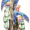 Een meerkleurig porseleinen lamp met beeld van 2 paradijsvogels. Bedrading manco. Bodem gesigneerd, verso gemerkt Arca, Italy.