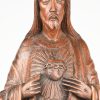 Een massief gesculpteerd eikenhouten beeld van Christus met het Heilig Hart. Gesigneerd N. Gorus. Heeft enkele barsten en een herstelling aan de linker knie, alsook een pink en een wijsvinger missend.
