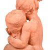 “Jongen en Meisje”. Een aardewerken gesculpteerd dubbel borstbeeld. Onderaan gesigneerd, gedateerd 1950 en genummerd 8/15.