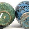Een lot van 2 antieke geglazuurd aardewerken kannen, de ene blauw met bladeren in het decor, de andere blauw-groen. Beide met randschade en beschadigd glazuur.