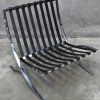 “Barcelona Chair”, ontworpen in 1929 voor het Barcelona pavilioen door Ludwig Mies Van Der Rohe en Lilly Reich, het betreft een uitvoering door De Coene uit Kortrijk die onder licentie van Knoll hebben gewerkt. De stoel is geproduceerd tussen 1960/70. Verchroomd staal en leder.