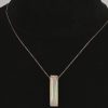 Een 18 kt roze gouden ketting met hanger bezet met een langwerpige opaal van 12,56 ct. en kleine briljantjes. Met certificaat.
