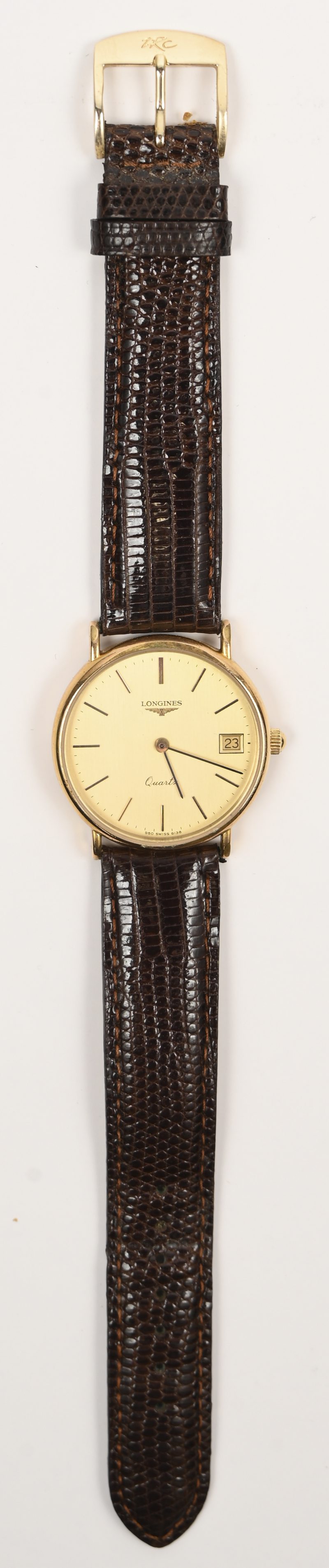 Een roestrvrij stalen horloge met bruin lederen gedragen polsband. In originele doos.