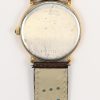Een roestrvrij stalen horloge met bruin lederen gedragen polsband. In originele doos.