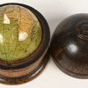 ‘Newton’s new and improved terrestrial globe’. Kleine reisglobe in originele houten opbergdoos. Published by Newton & son, Londen, 1830-38. Met schade aan de westkust van Afrika.
