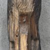 Een houten beeld van een Madonna met Kind naar Romaans voorbeeld.