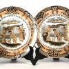 Een lot van 7 borden bestaande uit 3 x Petrus Regout met SANA motief, 2 x Longwy expedition du Tonkin, 1 x Boch Freres Keramis Les Combles en 1 x KPM gemonogrammeerd AH.