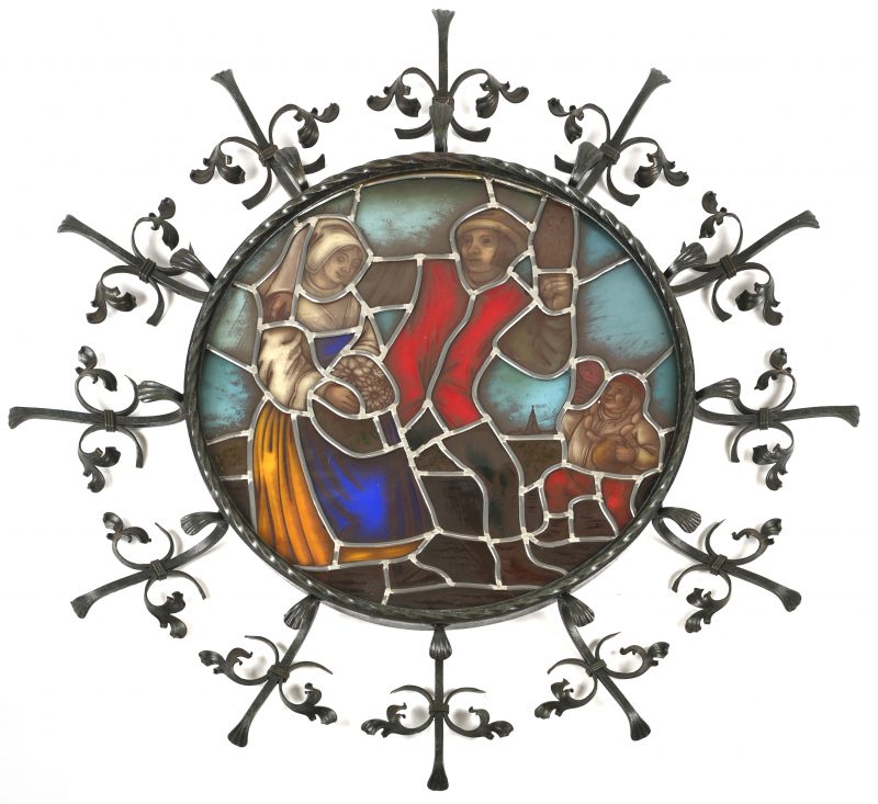 ‘Tijl en Nele’. Glas in lood, gemonteerd in ronde smeedijzeren kader.