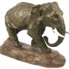 Een terracotta beeld van een olifant, gesigneerd P. Balestra.