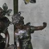 Een tafellamp met kunststoffen groep en glazen blakers gemerkt Art France. 2 vingers afgebroken maar erbij.