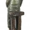 “Rokende man”, een gepolychromeerd bronzen beeld op marmeren voet, gesigneerd A. Boucher.