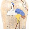 Een grote vaas van meerkleurig aardewerk, versierd met een decor van vogels, getekend; A. Dubois. Onderaan gemerkt. Gechipt aan de basis.