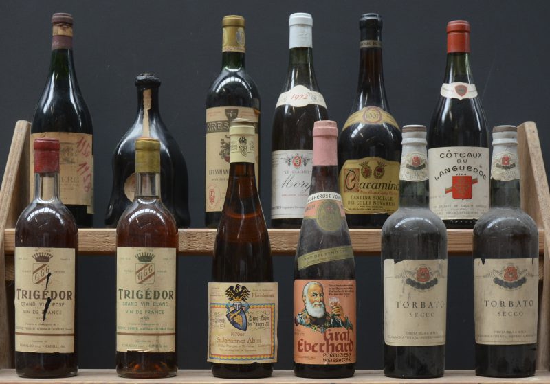 Lot wijn        aantal: 12 bt    Trigédor Grand Vin Rosé Vin de France  Frédéric Thibier, Bordeaux     aantal: 1 bt    Trigédor Grand Vin Blanc Vin de France  Frédéric Thibier, Bordeaux     aantal: 1 bt    St. Johanner Abtei Müller-Thurgau & Silvaner Rheinhessen  Ferd. Pieroth, Bingen E.A.  1970  aantal: 1 bt    Graf Eberhard Portugieser Weissherbst        aantal: 1 bt    Torbato Secco   Sella & Mosca Vini     aantal: 2 bt    Roodeberg  Paarl       aantal: 1 bt    Roodeberg  Paarl       aantal: 1 bt    Sizzano D.O.C.  Troglia, Torino M.O.  1967  aantal: 1 bt    Kressmann Sélection A.C Bordeaux   M.O.    aantal: 1 bt    Morgon Le Clachet A.C.   Georges Brun, Villi-Morgon M.O.  1972  aantal: 1 bt    Côteaux du Languedoc V.D.Q.S.  Paul Herpe, Narbonne M.O.  1964  aantal: 1 bt    Caramino Vino Riserva della Cantina   Cantina Sociale dei Colli Novaresi M.O.  1967  aantal: 1 bt