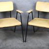 Een set van vier vintage Tubax armstoelen, ontworpen in de jaren 50 door Willy van der Meeren. Bekleed met mosterdgele skai op een zwart metalen buisframe.
