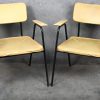 Een set van vier vintage Tubax armstoelen, ontworpen in de jaren 50 door Willy van der Meeren. Bekleed met mosterdgele skai op een zwart metalen buisframe.