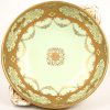 Een porseleinen milieu-de-table gemerkt Noritake met fijne goudkleurige decoraties.