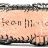 Een zwart geglazuurd aardewerken kommetje in de vorm van een vis, gesigneerd Jean Marais.