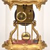 Een mantelklokje, koper, glas en kunststof, gemerkt Schmidt.
