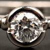 Een 18 kt witgouden ring bezet met centrale briljant van 0,56 ct.