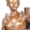 “V’la le Plaisir”. Bronzen beeld van een jonge vrouw met een koker met windroos met bruin patina. Gesigneerd.