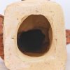 ‘Zittend naakt’, een gepatinneerde terra cotta torso. Gemerkt; R.W. 00.