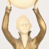 “Danseres met bal”. Een art deco beeldje van verguld brons en celluloid op onyxen voetstuk.