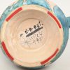 Een vintage lava-glaze vaas, met de afbeeldingen van Pan en Bachus. Getekend; Italy, 437.