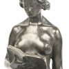 ‘Knielend naakt met boek’, een gepatinneerd bronzen beeldje. Getekend; A. Puttemans.