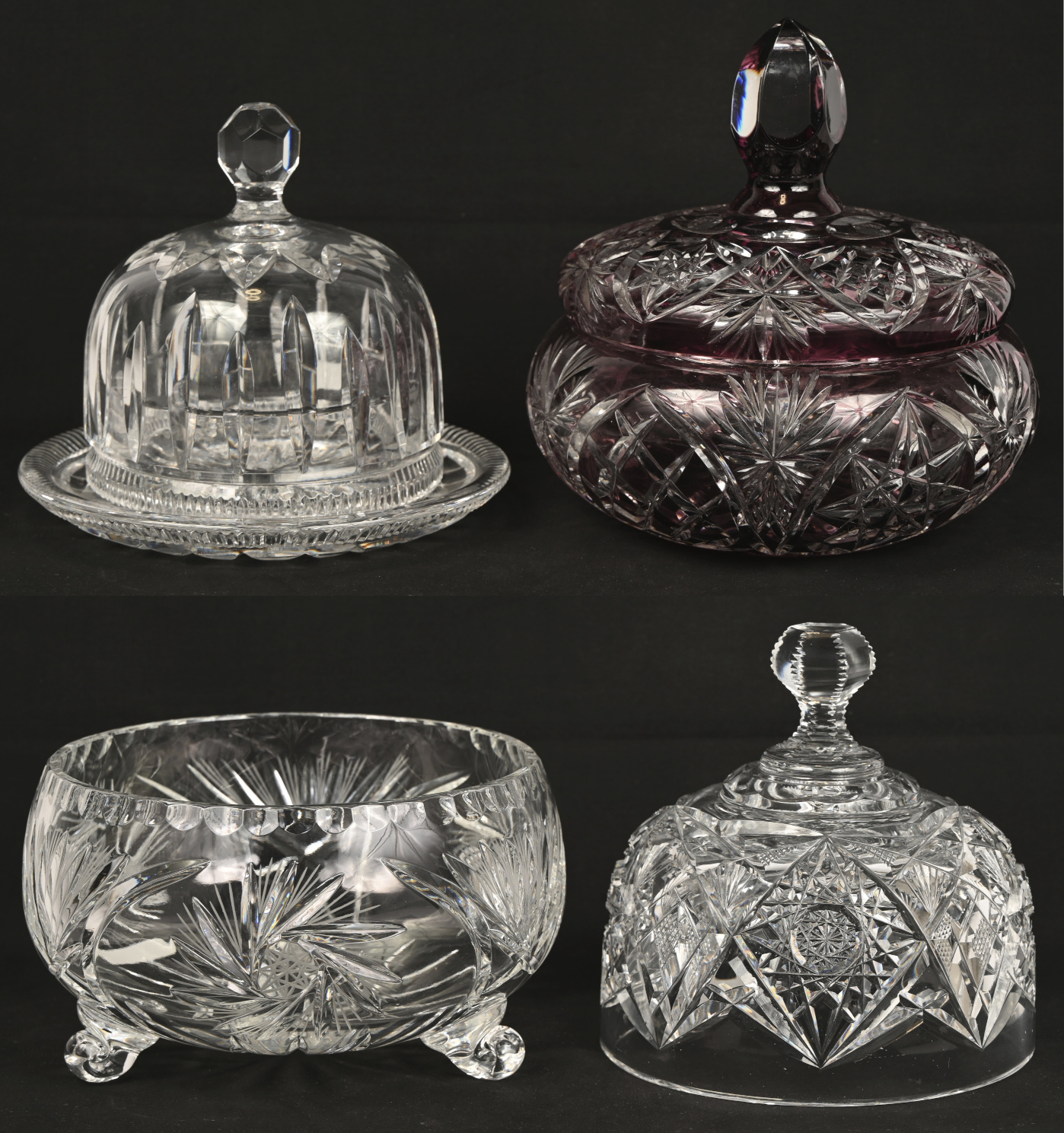 Een gevarieerd lot kleurloos en gekleurd kristal bestaande uit een bonbonniere, twee stolpen waarvan één met voet en een coupe Een gevarieerd lot kleurloos en gekleurd kristal bestaande uit een bonbonniere, twee stolpen waarvan één met voet en een coupe.