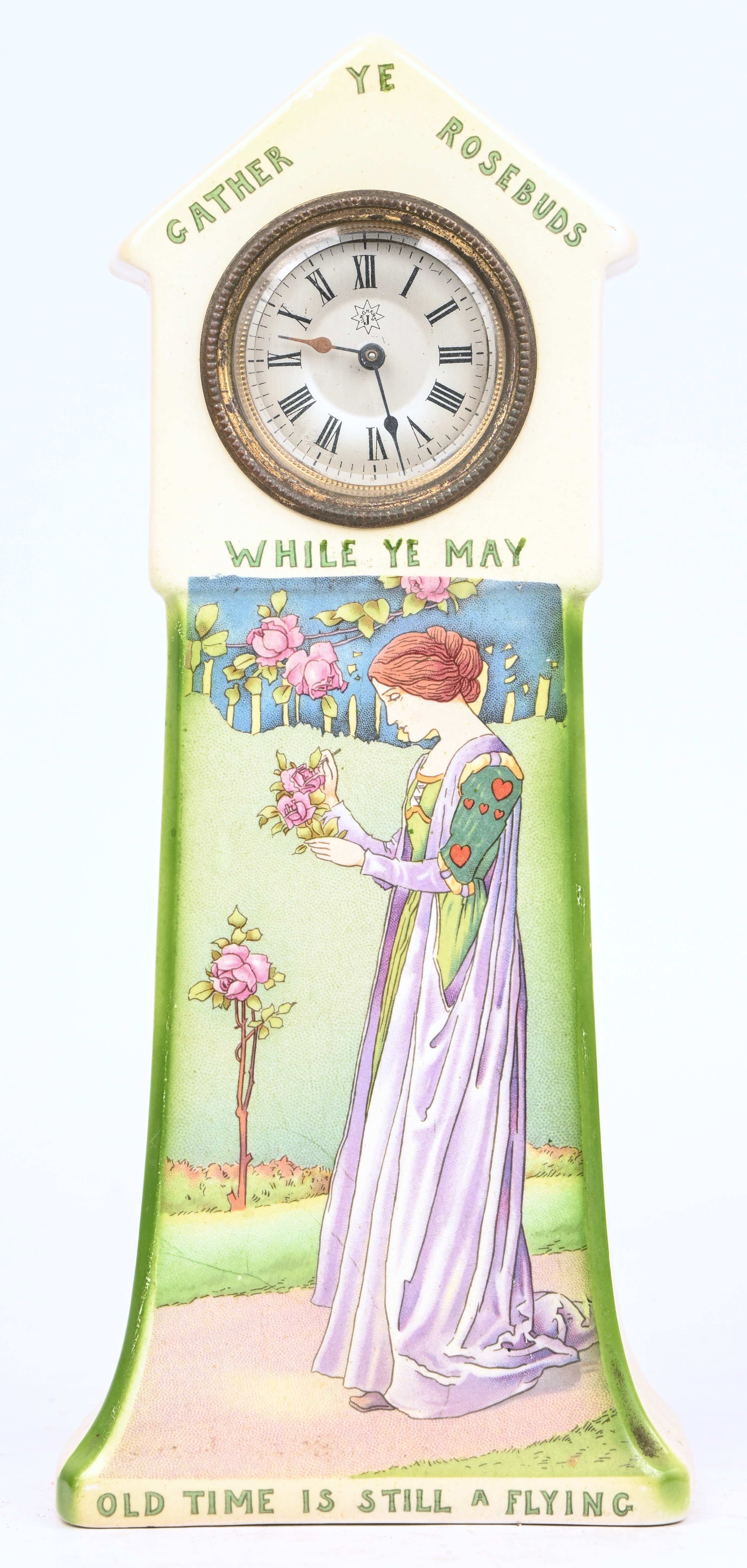 Een mantelklokje in een geglazuurde aardewerken kastje. Gemerkt; Dujardin Lammens Een mantelklokje in een geglazuurde aardewerken kastje. Gemerkt; Dujardin Lammens.