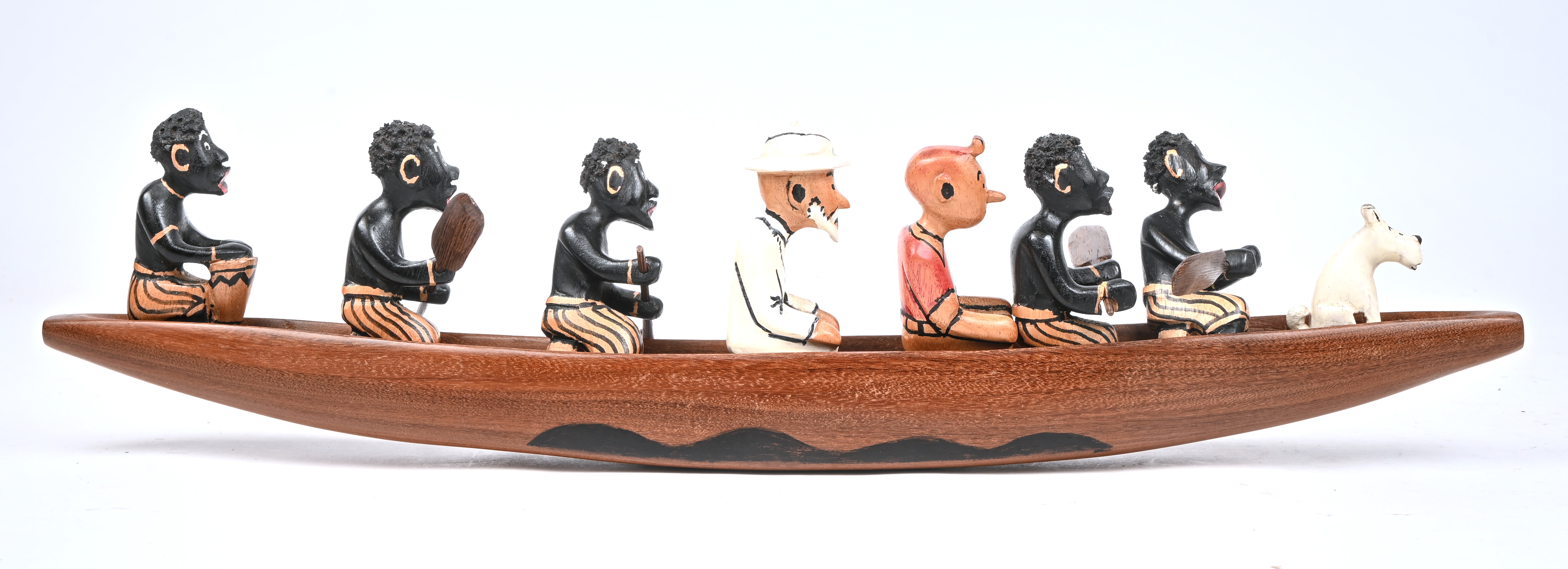 ‘Kuifje en Bobby in een Afrikaanse kano’, een Afrikaanse houten sculptuur ‘Kuifje en Bobby in een Afrikaanse kano’, een Afrikaanse houten sculptuur.