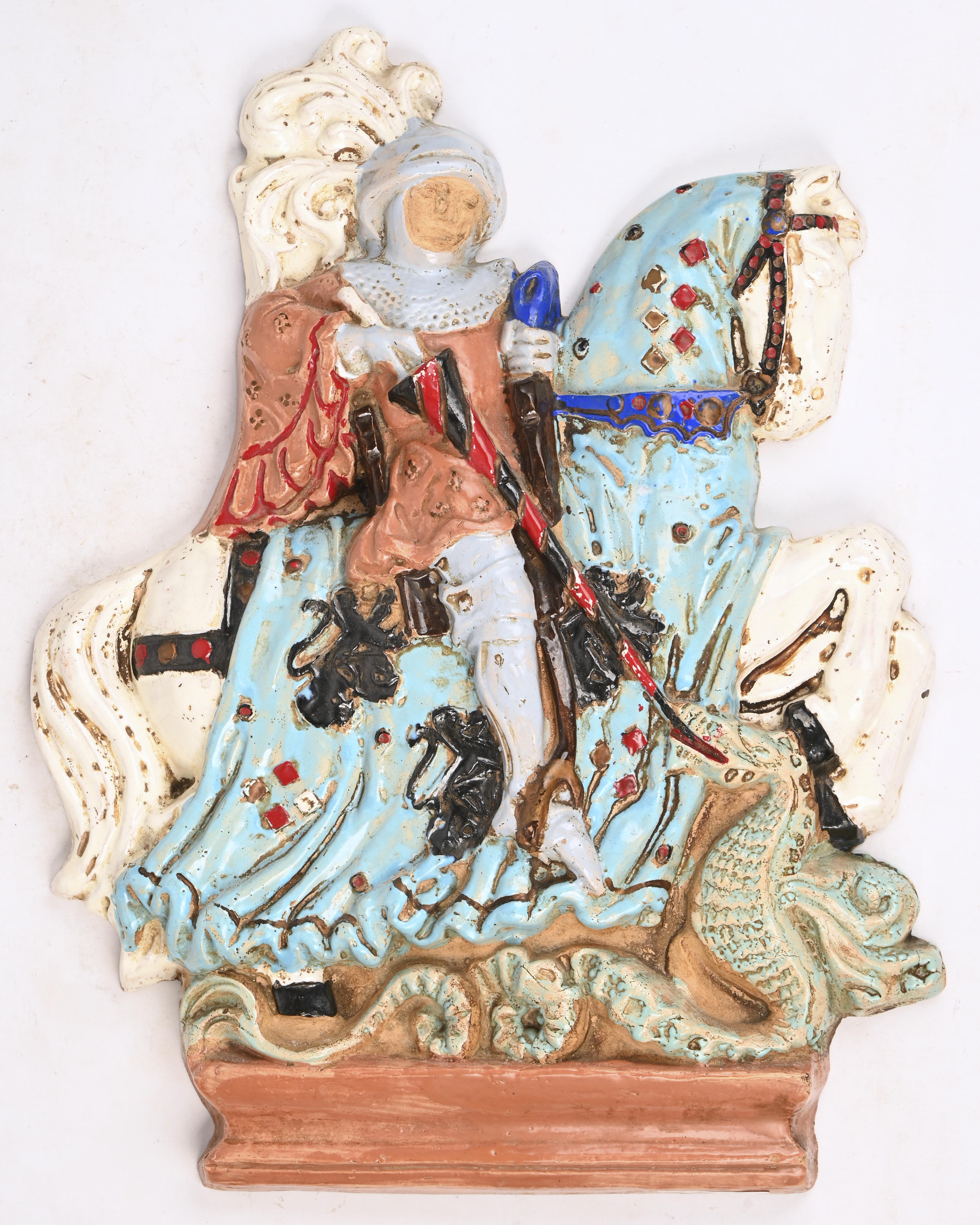 Een keramisch reliëf van Sint Joris. Achteraan gemerkt Gres Guerin Bouffioulx Een keramisch reliëf van Sint Joris. Achteraan gemerkt Gres Guerin Bouffioulx.