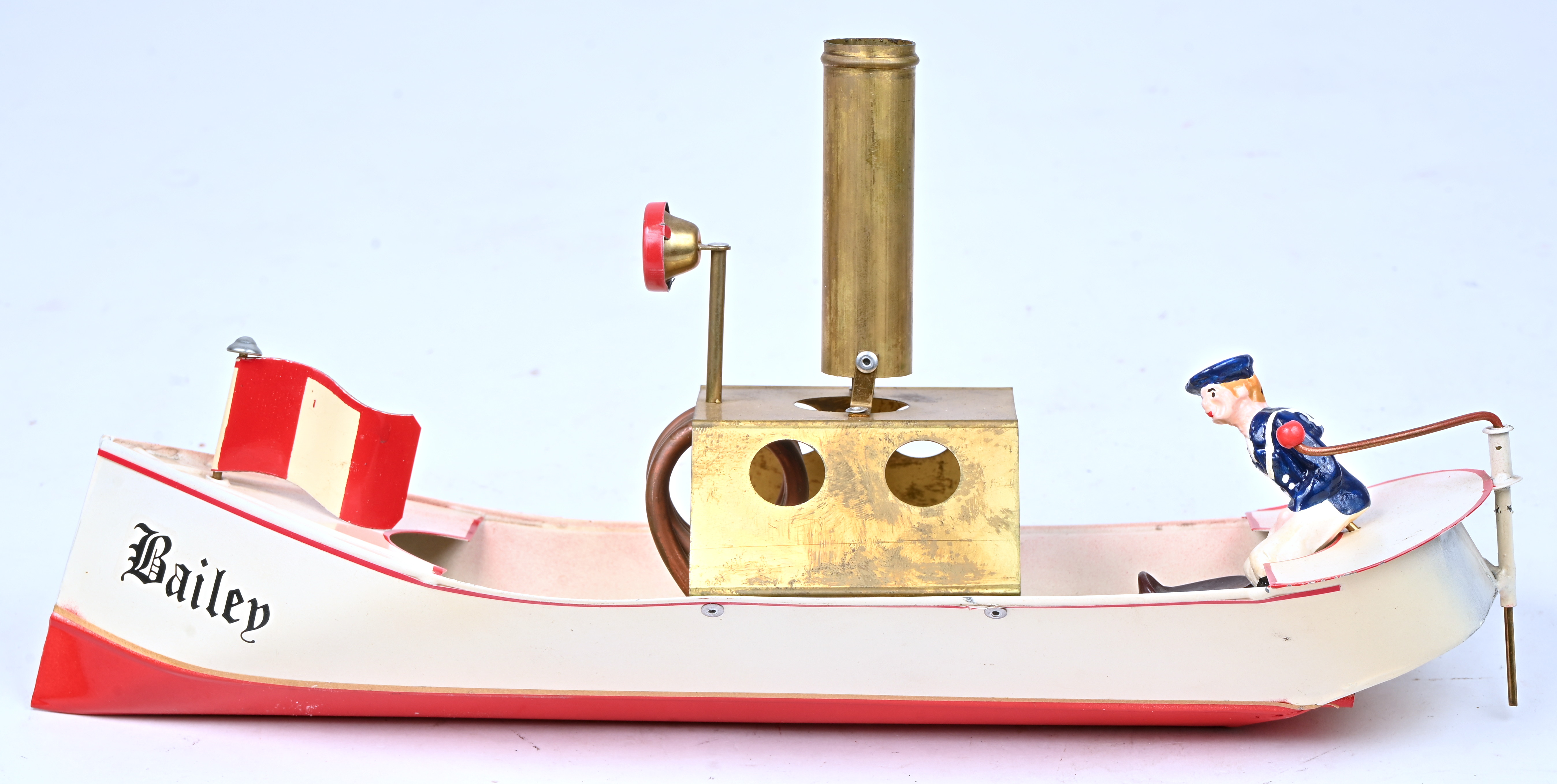 Een blikken ‘Pop-pop bootje’, model ‘Bailey’. Het roer is manco Een blikken ‘Pop-pop bootje’, model ‘Bailey’. Het roer is manco.