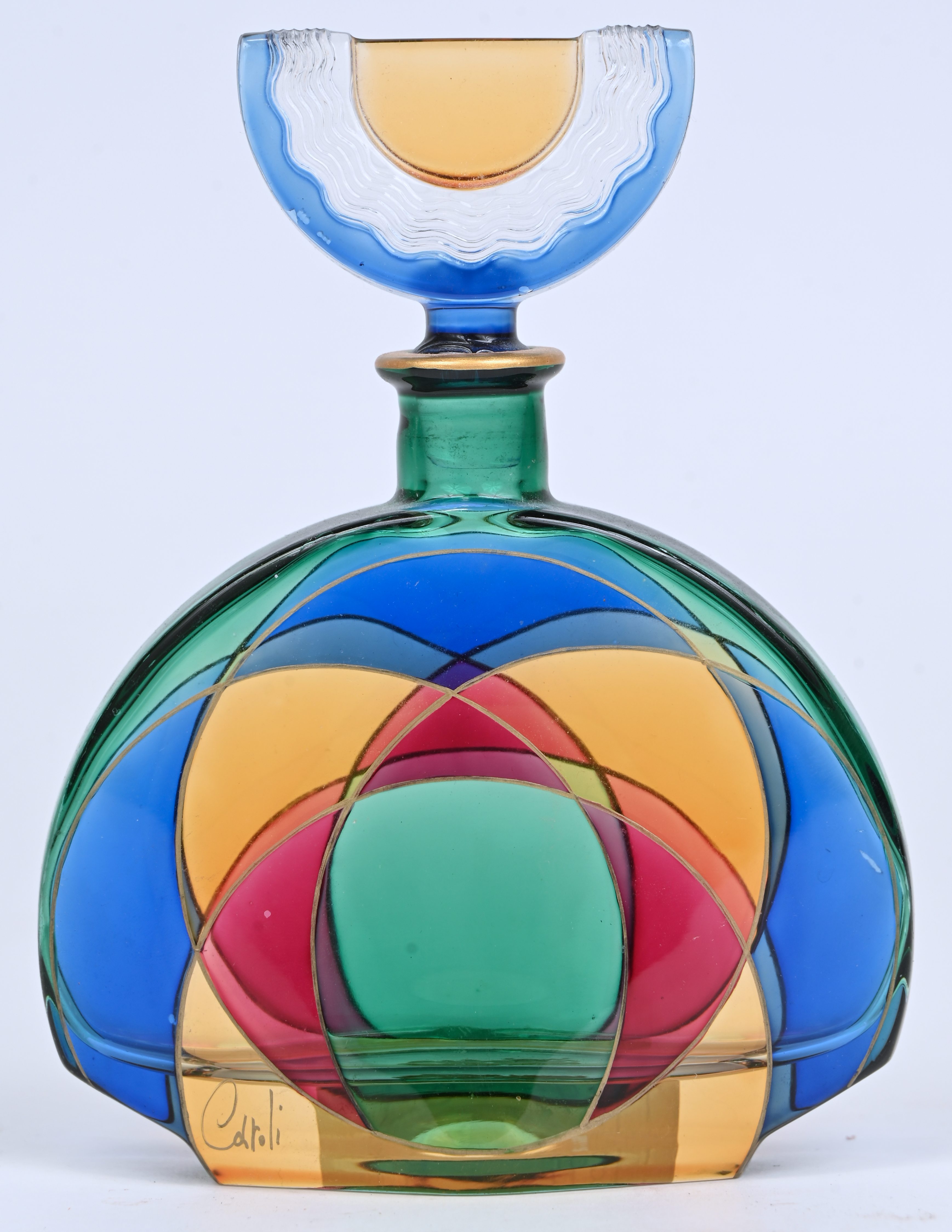 Een parfumflacon, meerkleurig glas, gemerkt Caroli, Venezia Een parfumflacon, meerkleurig glas, gemerkt Caroli, Venezia.