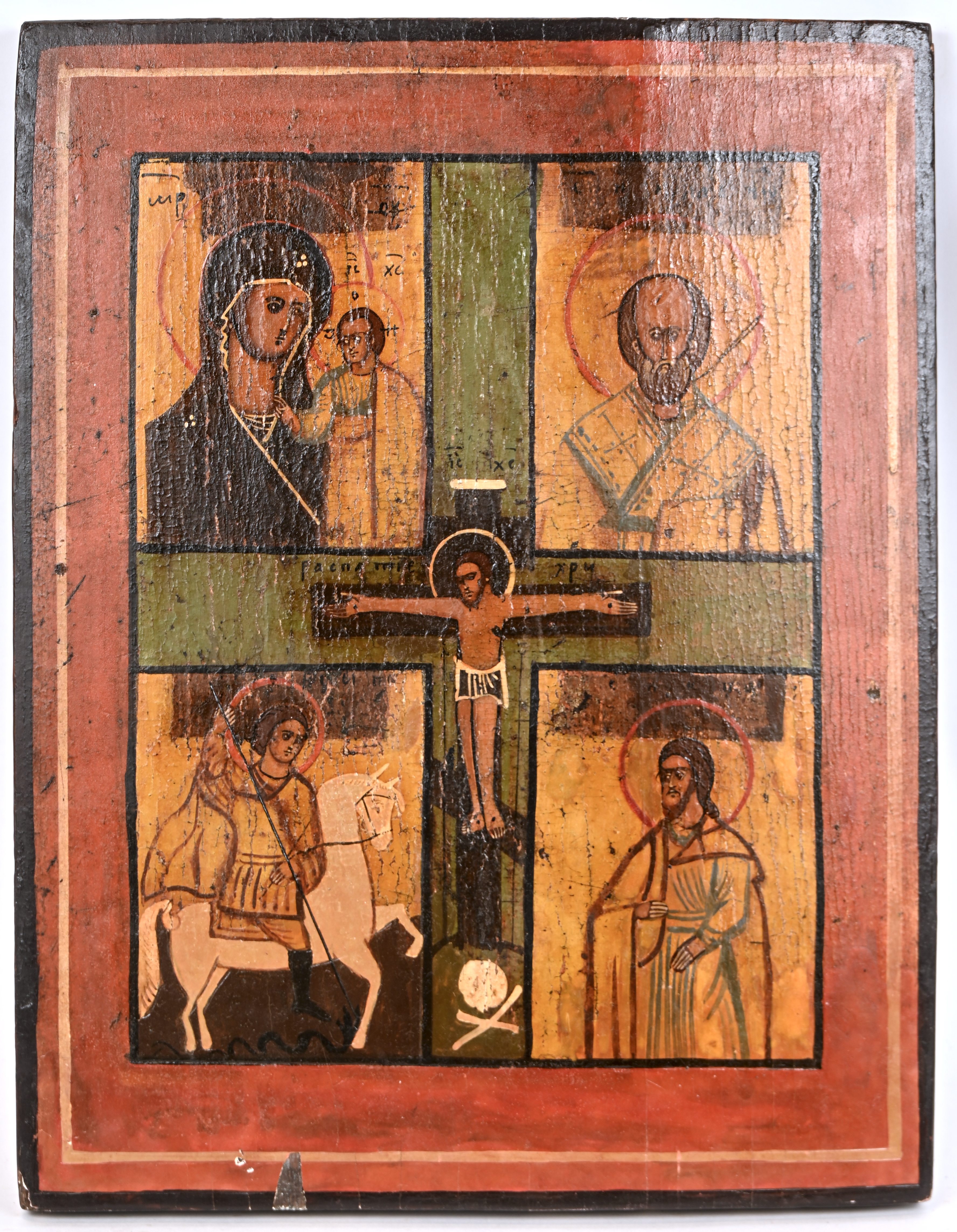 “Christus aan het Kruis, met in vier kwarten, Sint-Georg, Sint-Nicolaas, de Moeder Gods van Kazan en Christus”. Russische icoon. Tempera op paneel, deels met bladzilver. XIXde eeuw “Christus aan het Kruis, met in vier kwarten, Sint-Georg, Sint-Nicolaas, de Moeder Gods van Kazan en Christus”. Russische icoon. Tempera op paneel, deels met bladzilver. XIXde eeuw.