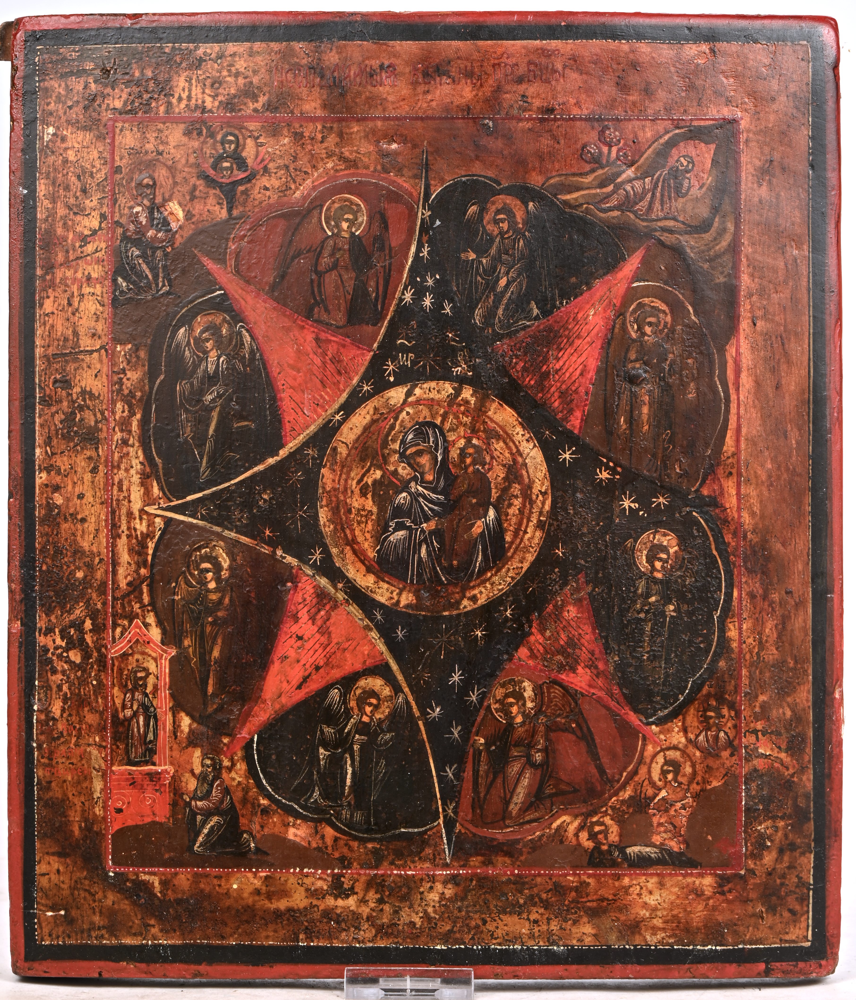 “De Moeder Gods met Christus centraal en met talrijke Heiligen en Engelen”. Russische icoon. Tempera op paneel, XIXde eeuw “De Moeder Gods met Christus centraal en met talrijke Heiligen en Engelen”. Russische icoon. Tempera op paneel, XIXde eeuw.