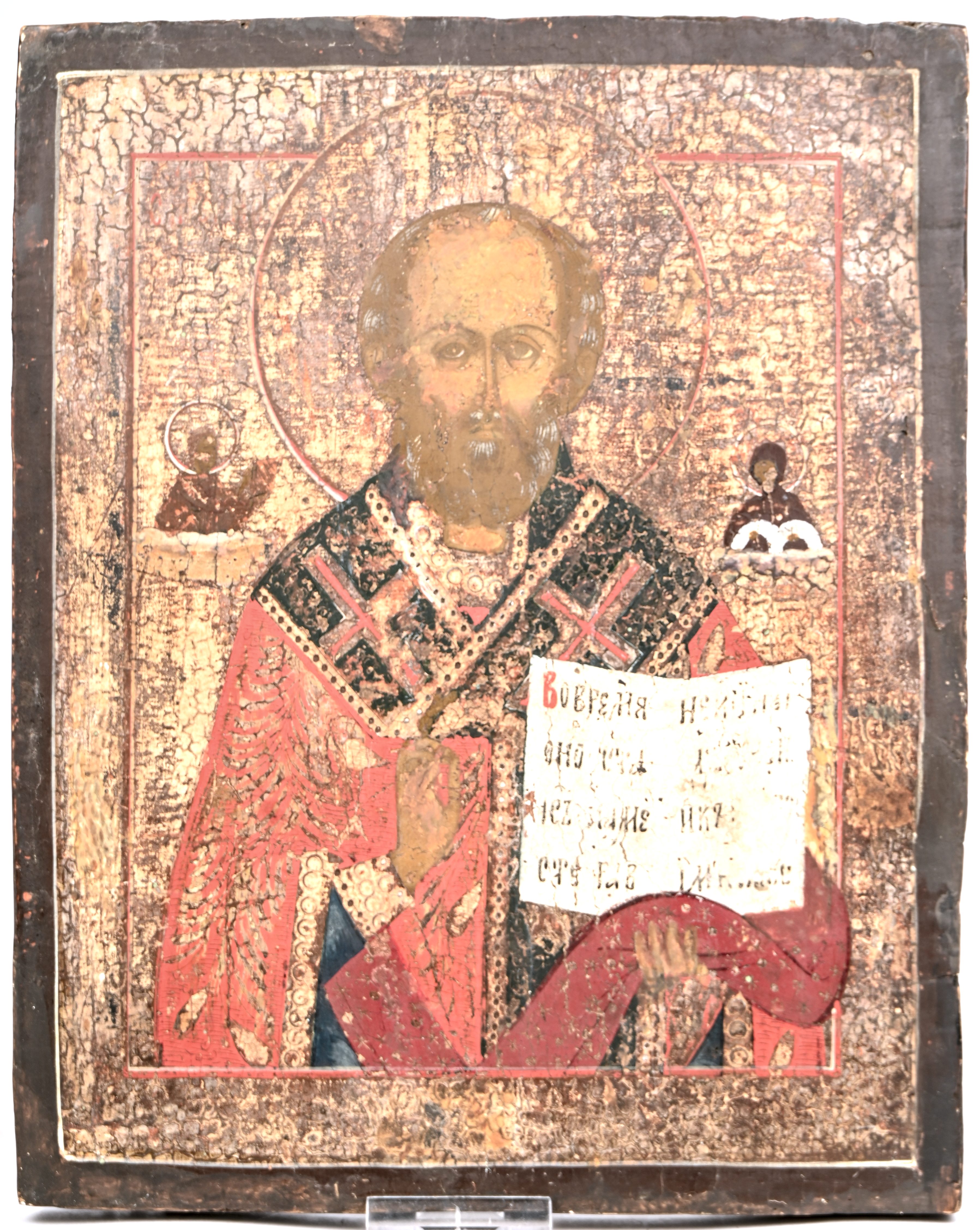 “Sint Nicolaas de wonderdoener”. Russische icoon. Tempera en zilverfolie op paneel, XIXde eeuw “Sint Nicolaas de wonderdoener”. Russische icoon. Tempera en zilverfolie op paneel, XIXde eeuw.